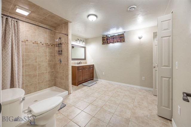 bathroom featuring curtained shower, toilet, vanity, and tile patterned flooring