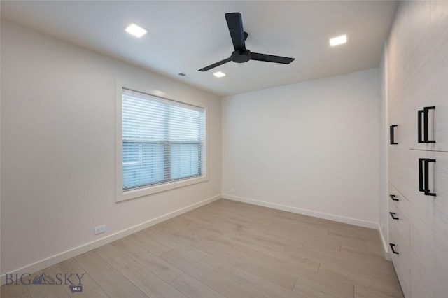 unfurnished room with light hardwood / wood-style flooring and ceiling fan