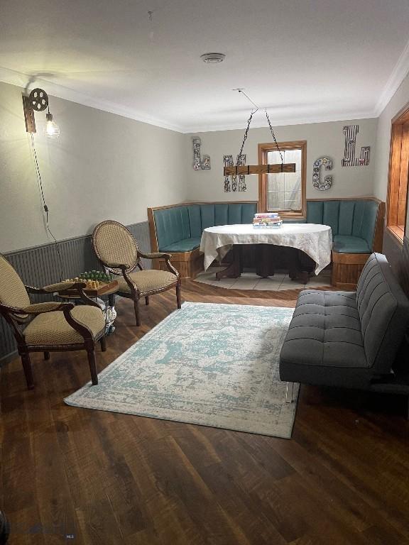 bedroom with hardwood / wood-style flooring and ornamental molding