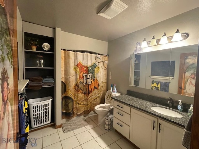 bathroom featuring vanity, tile patterned flooring, toilet, and a shower with shower curtain