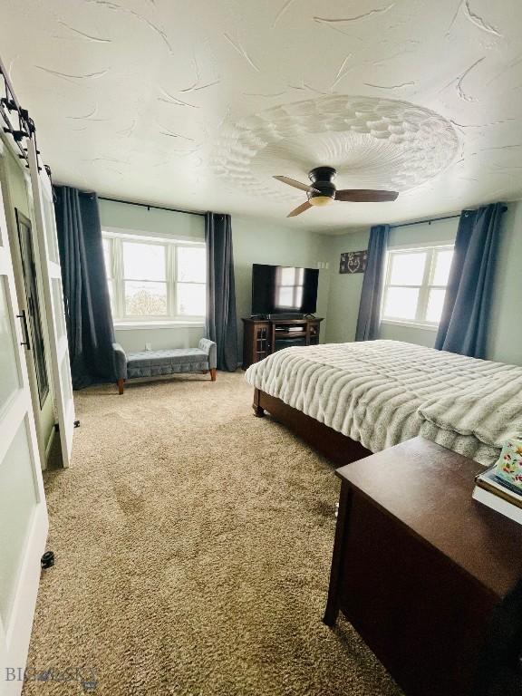 bedroom with carpet floors and ceiling fan