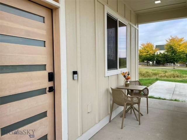 view of exterior entry featuring a porch