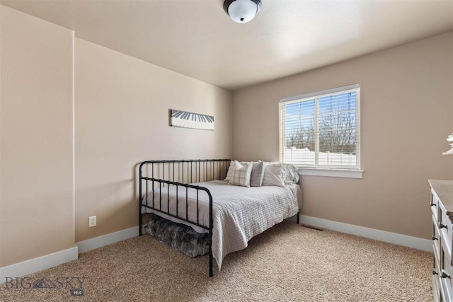 bedroom featuring light colored carpet