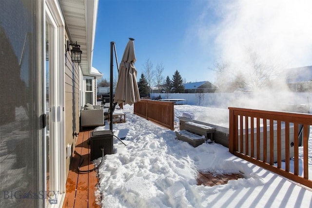 view of snow covered deck