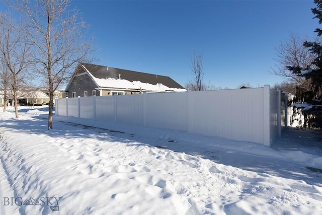 view of yard layered in snow