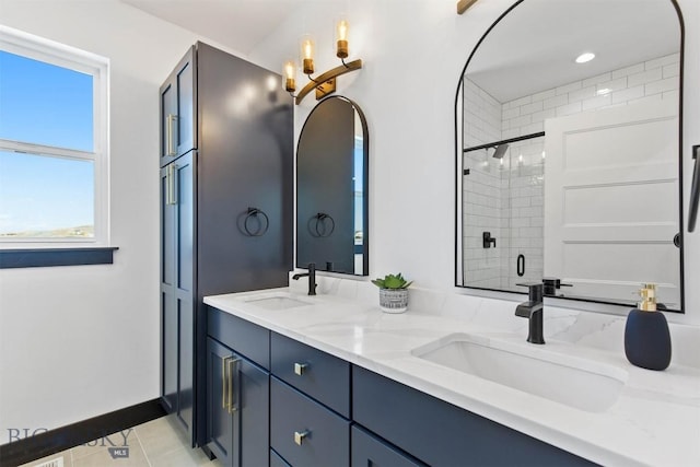 bathroom featuring tile patterned flooring, walk in shower, and vanity