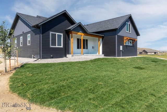 view of front of house featuring a porch and a front lawn