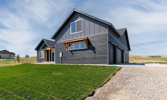 view of front of property with a garage and a front lawn