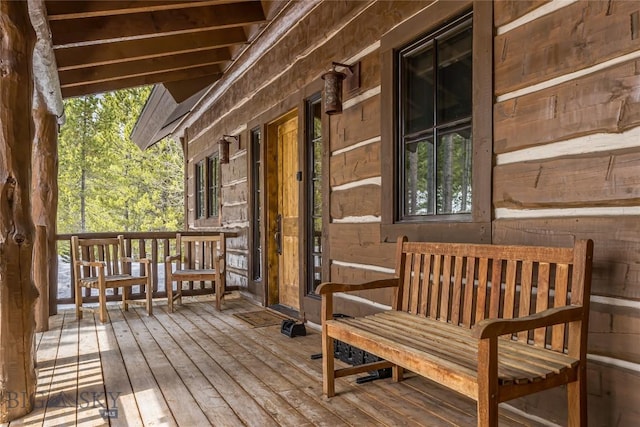 wooden terrace with a porch