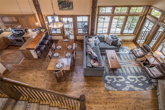 living room featuring a chandelier and dark hardwood / wood-style floors