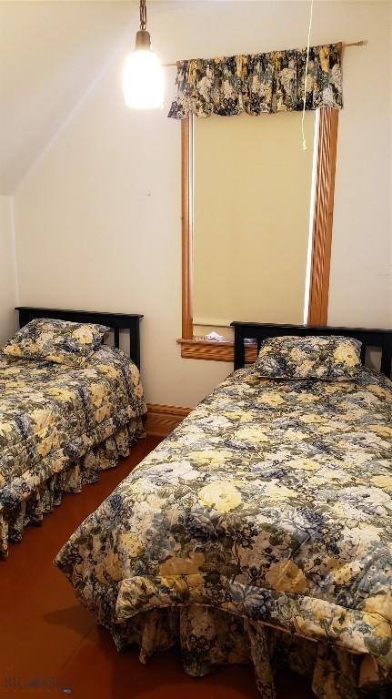 bedroom featuring vaulted ceiling