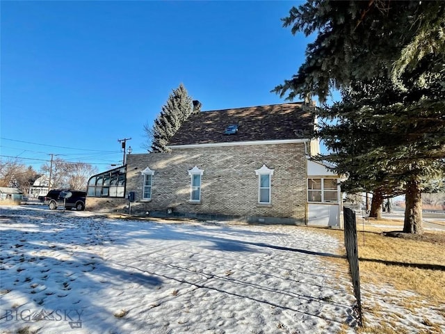 view of snow covered house