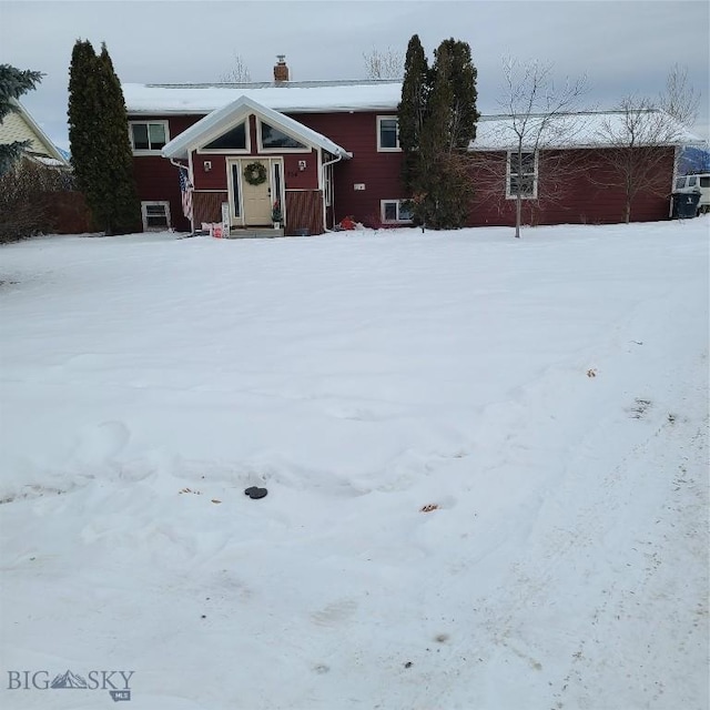 view of yard covered in snow