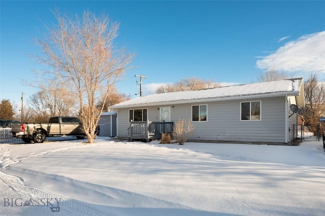 ranch-style house with a wooden deck