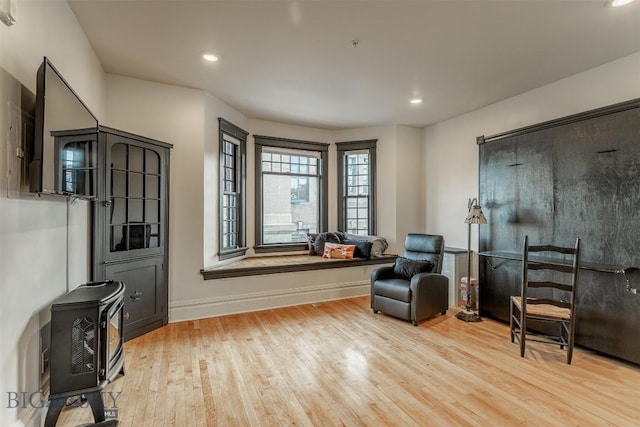 sitting room with light hardwood / wood-style flooring