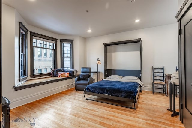 bedroom with light wood-type flooring