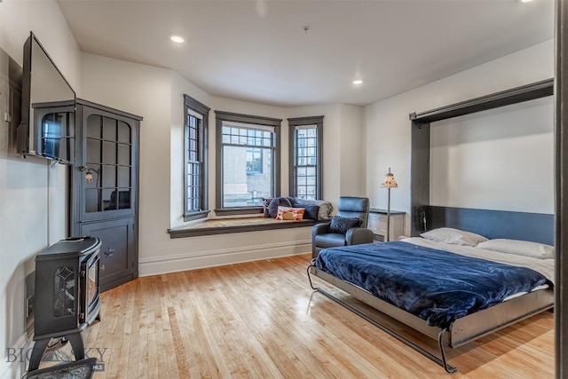 bedroom featuring light hardwood / wood-style floors