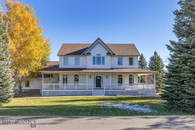 country-style home with a front lawn and a porch