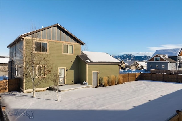 rear view of house featuring a mountain view