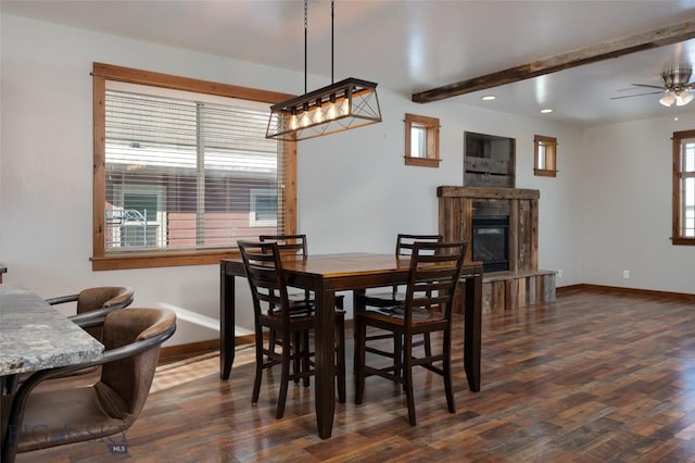 dining area featuring beam ceiling, ceiling fan, and dark hardwood / wood-style flooring