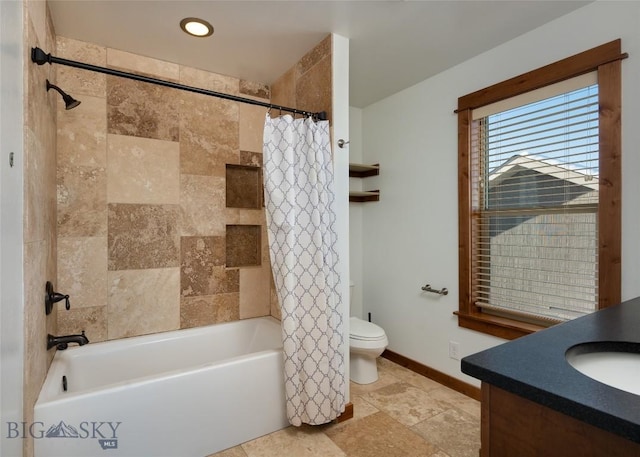 full bathroom featuring vanity, toilet, and shower / bath combo with shower curtain