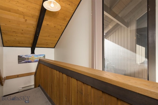 hallway featuring a baseboard heating unit, carpet, vaulted ceiling with beams, and wooden ceiling