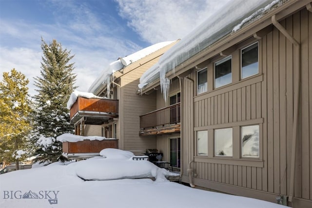 view of snow covered property