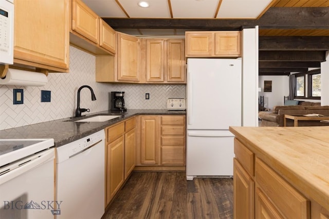 kitchen featuring dark hardwood / wood-style floors, light brown cabinetry, beamed ceiling, sink, and white appliances