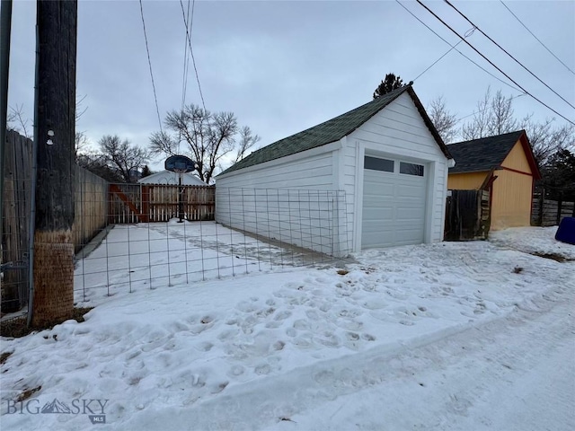 view of snow covered garage