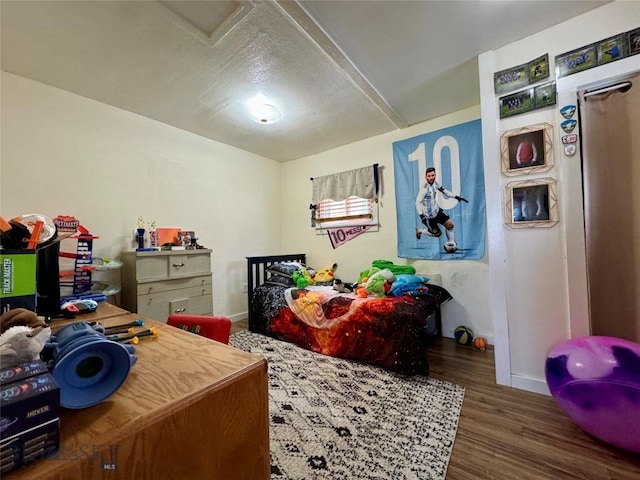 bedroom with dark wood-type flooring