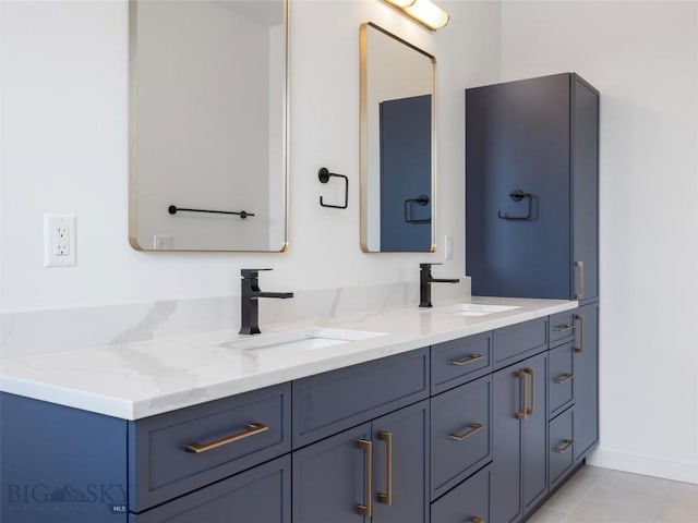 bathroom with tile patterned floors and vanity