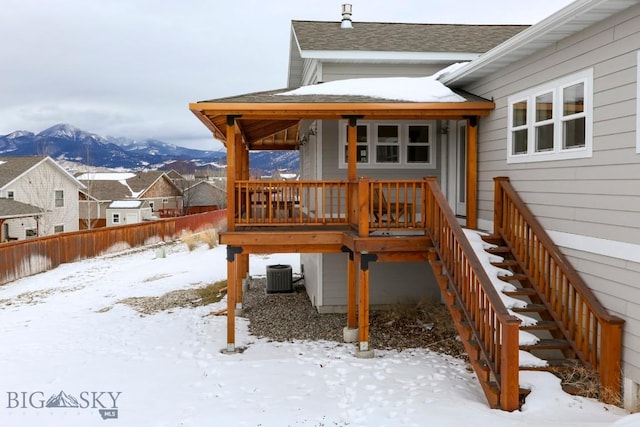 exterior space featuring a mountain view and central AC unit