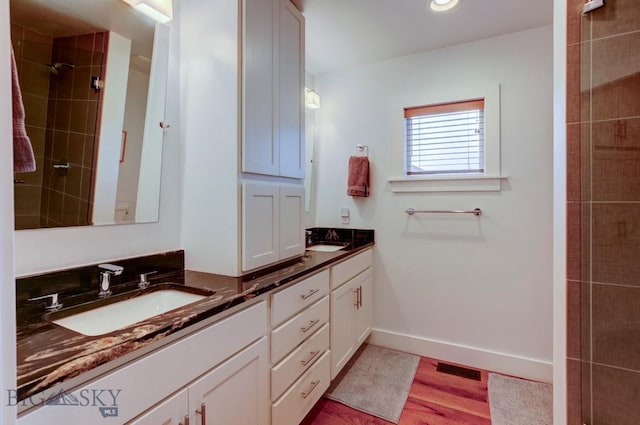 bathroom featuring vanity and hardwood / wood-style flooring