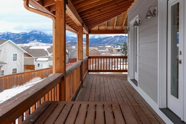 snow covered deck featuring a mountain view