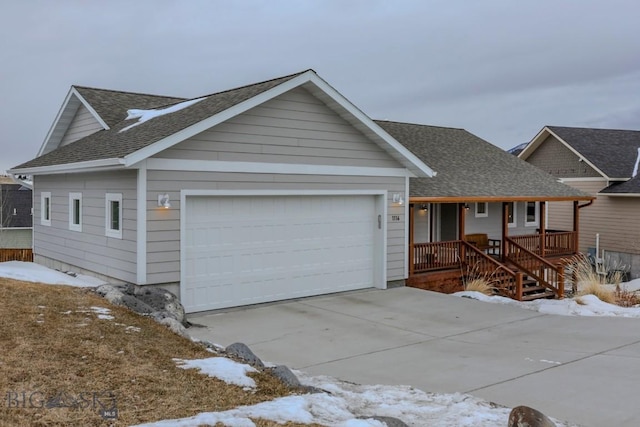 view of front of home with a garage and covered porch