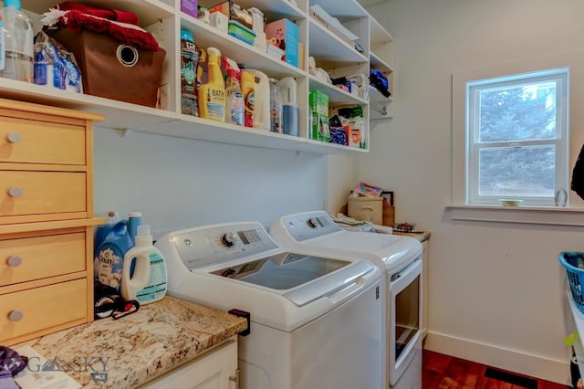 washroom featuring dark hardwood / wood-style floors and washing machine and dryer