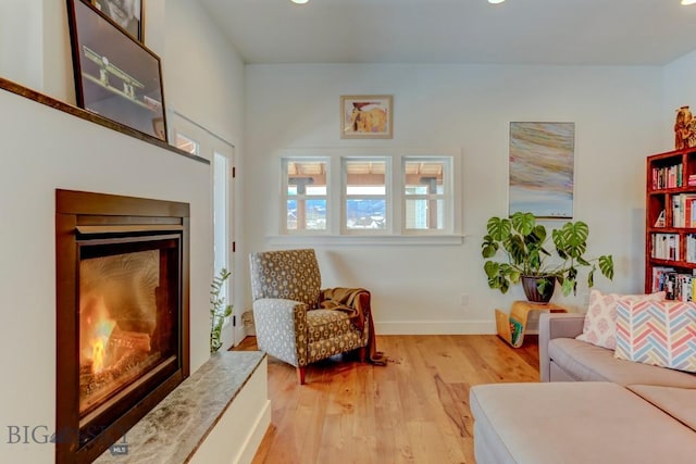 sitting room with light hardwood / wood-style floors