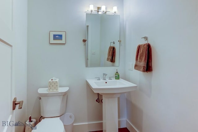 bathroom with sink and toilet