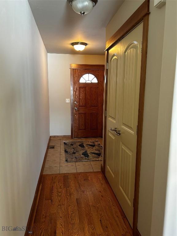 doorway to outside featuring hardwood / wood-style flooring