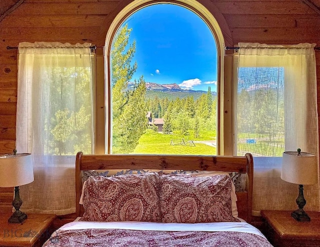 bedroom featuring multiple windows