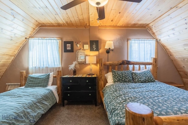 carpeted bedroom with multiple windows, lofted ceiling, and ceiling fan