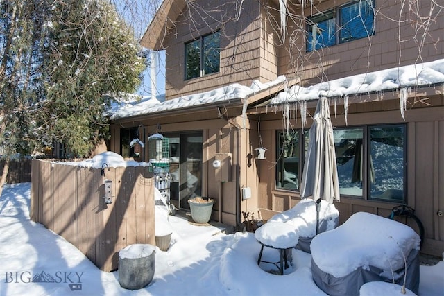 view of snow covered house