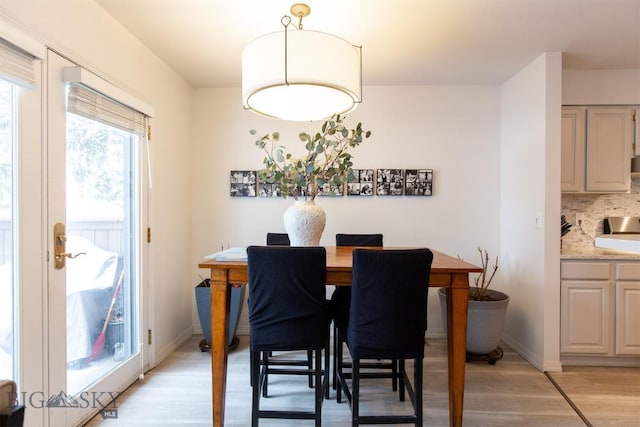 dining area featuring light wood-type flooring