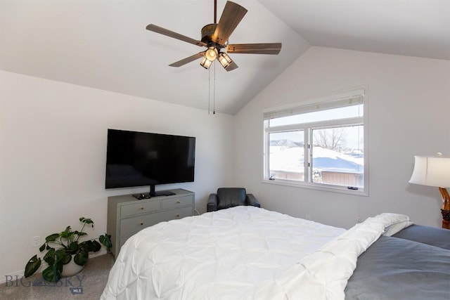 bedroom with ceiling fan, lofted ceiling, and carpet