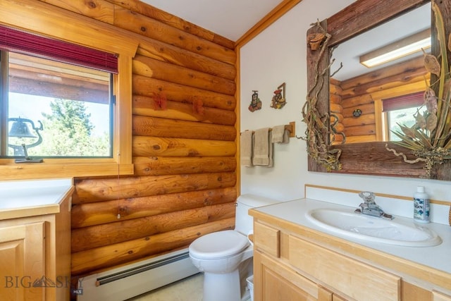 bathroom with vanity, rustic walls, baseboard heating, and toilet