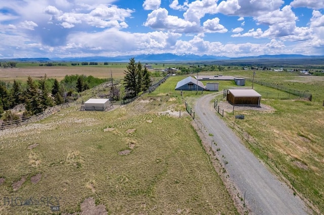 drone / aerial view with a mountain view and a rural view