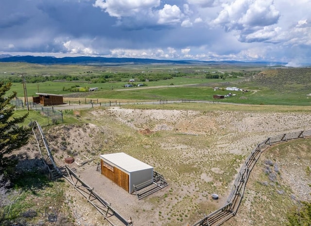 drone / aerial view featuring a rural view and a mountain view