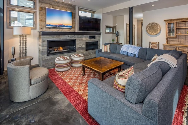 2174 Little Coyote Rd, Big Sky, MT 59716 - living room with a fireplace, finished concrete flooring, and recessed lighting