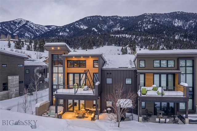 2174 Little Coyote Rd, Big Sky, MT 59716 - snow covered building with a mountain view