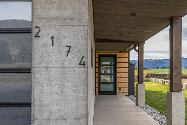 2174 Little Coyote Rd, Big Sky, MT 59716 - entrance to property with a mountain view and a lawn